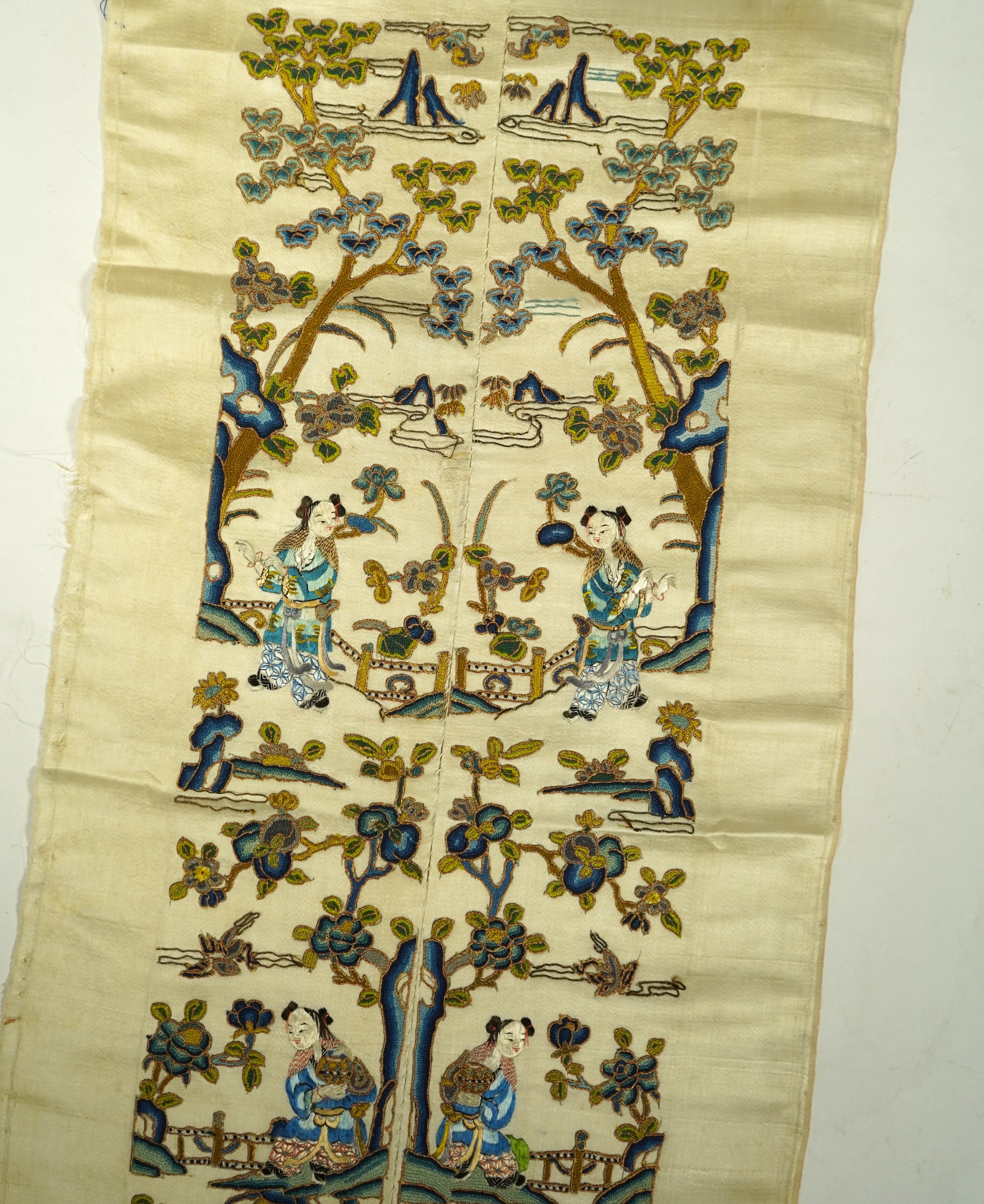 A pair of late 19th century Chinese figurative silk embroidered sleeve bands. Embroidered on cream silk using mostly Chinese knot, couched with gold thread. 53cm x 9cm each wide. Condition - cream silk, embroidery are bo